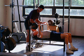 Image of bench press using forced reps training.