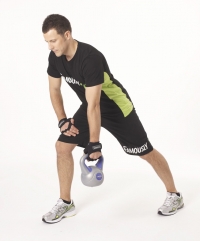 Picture of male doing back exercises using a kettlebell.